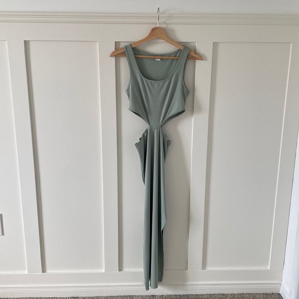 Sage green ribbed body-con midi dress with side cut-outs and side slit.